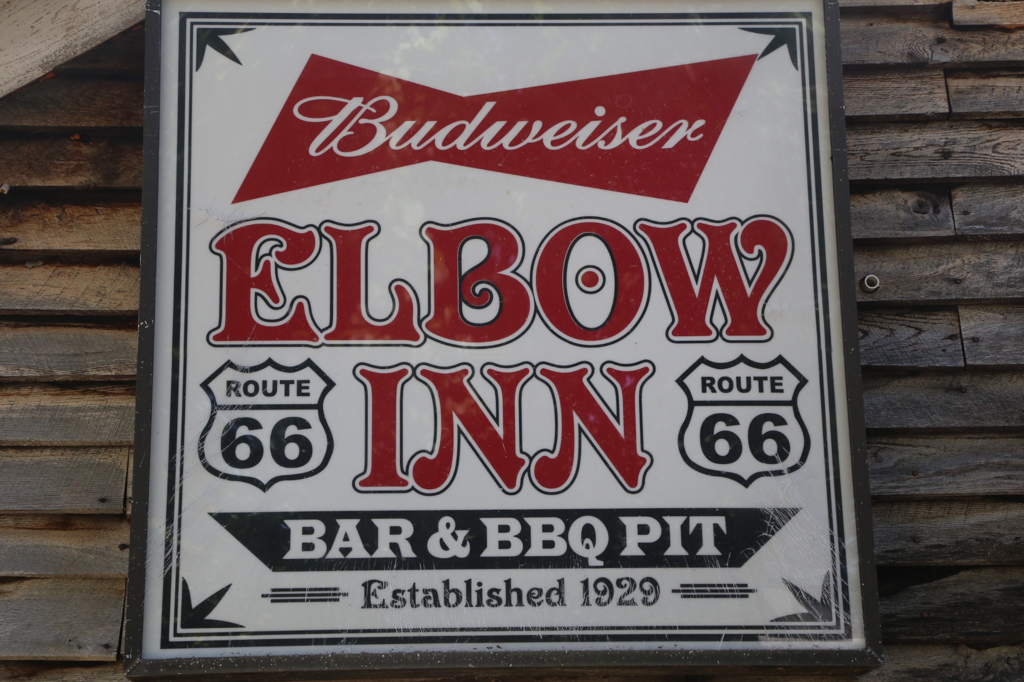 The vintage Elbow Inn Bar & BBQ Pit sign