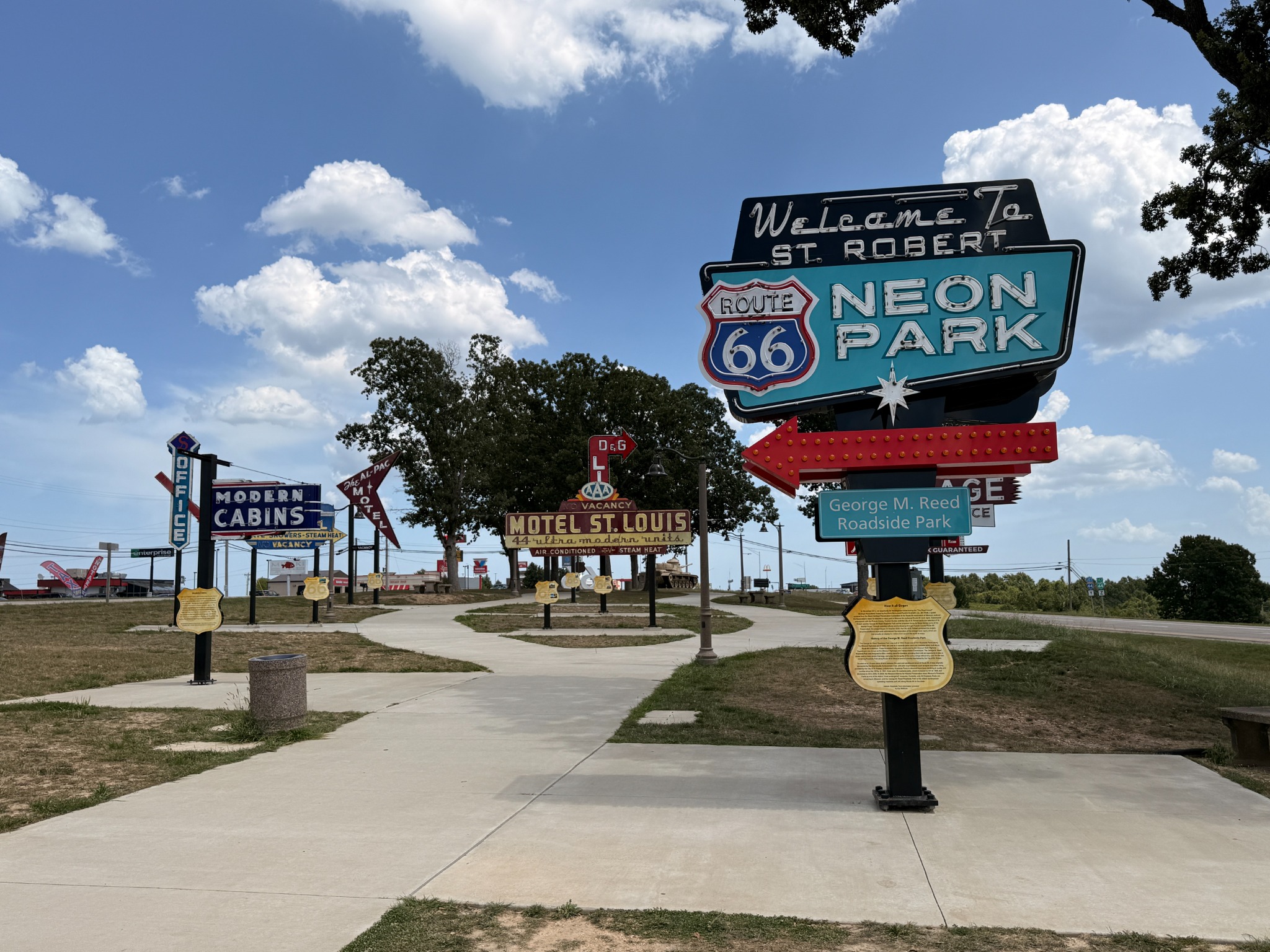 Restored roadside signs at Route 66 Neon Park in St. Robert