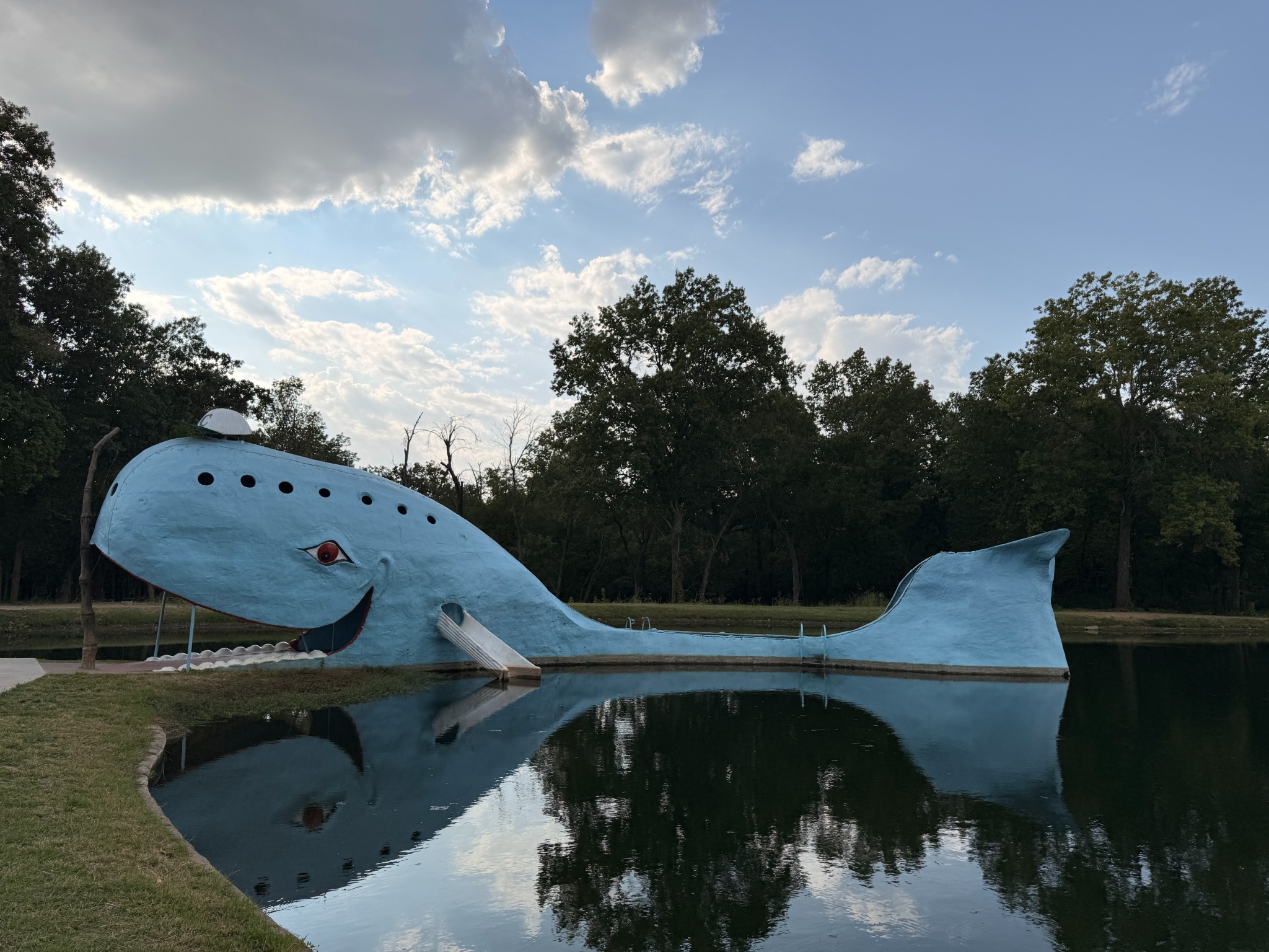 The Blue Whale of Catoosa reflected in the pond