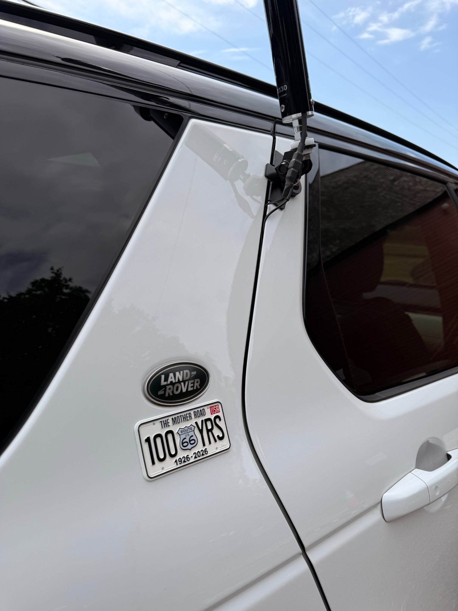 The antenna mount and Route 66 centennial badge.
