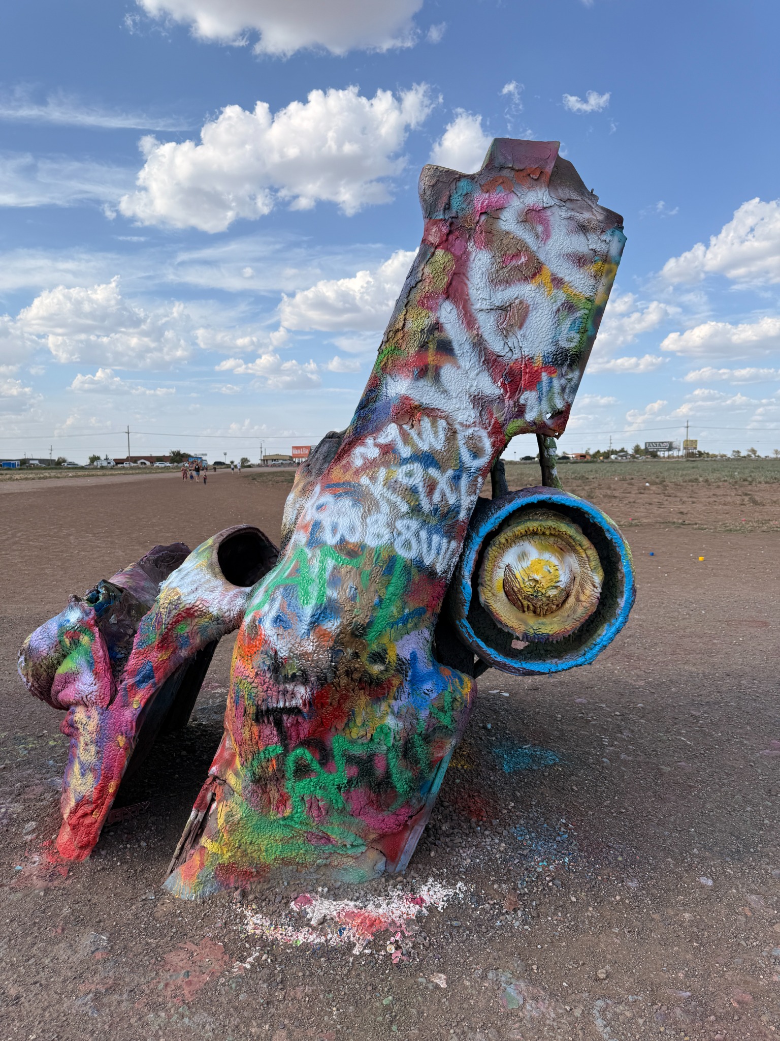 A close-up of a paint-covered Cadillac.