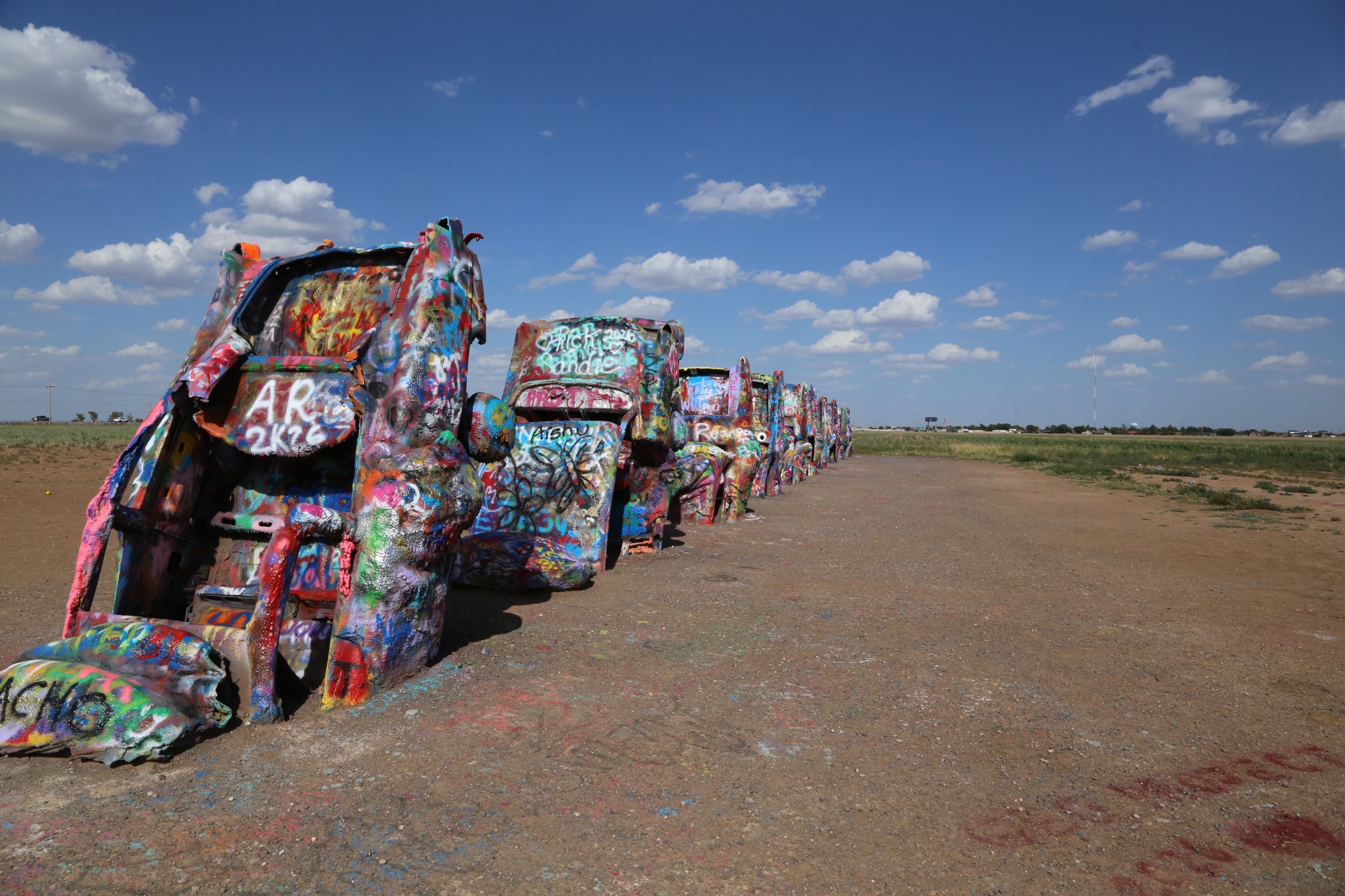 Cadillac Ranch under a bright Texas sky.