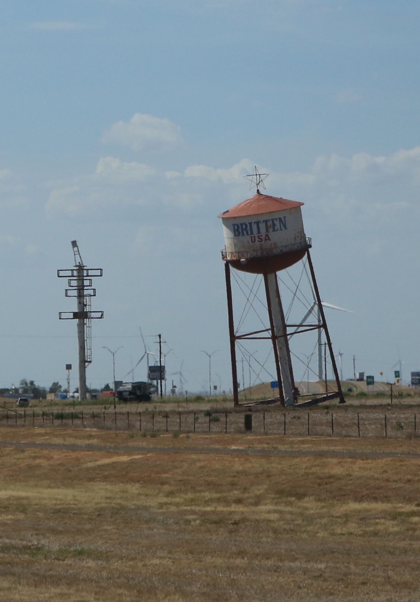 The leaning Britten USA water tower along the Texas road.