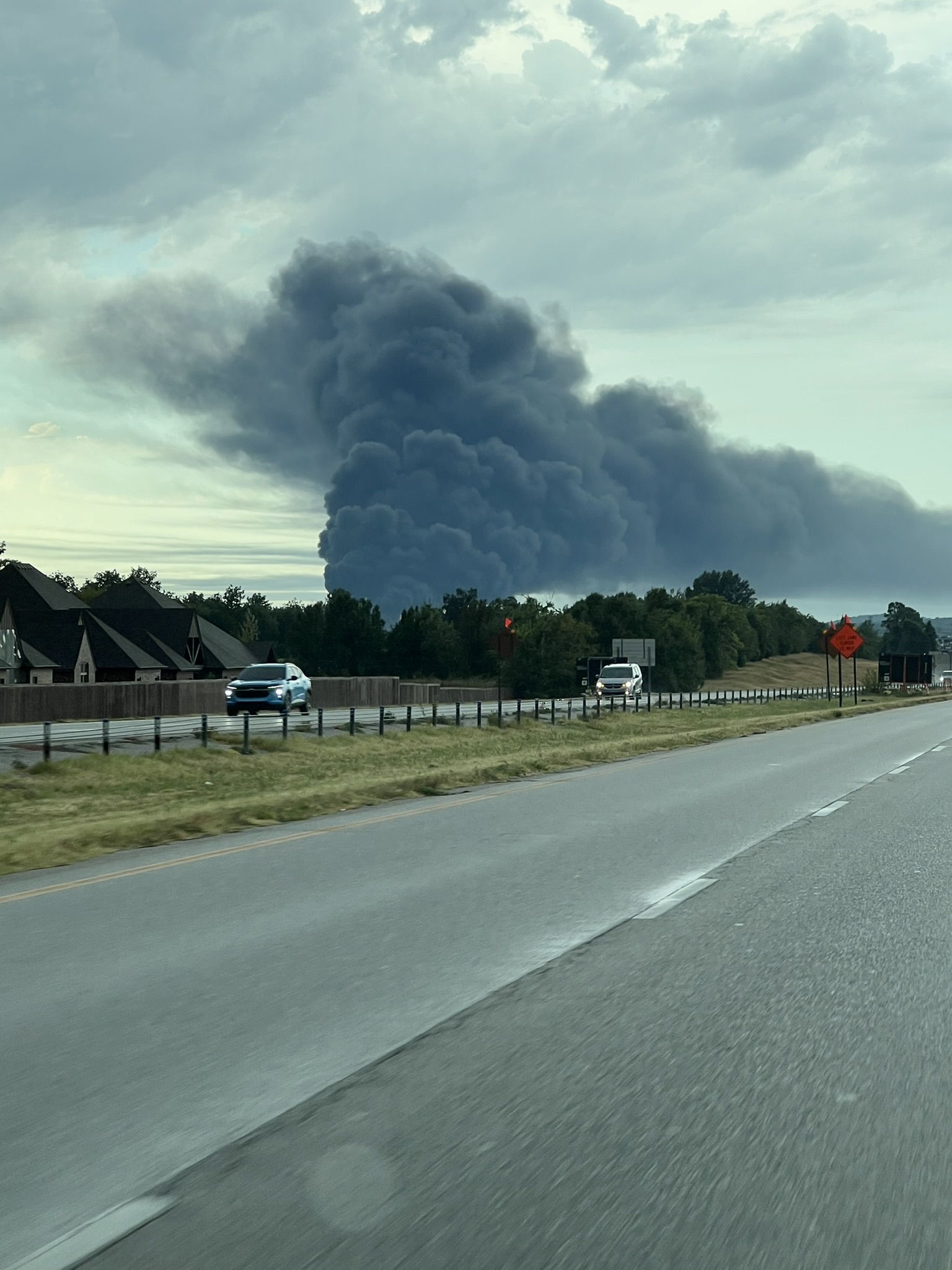 A huge plume of black smoke near Tulsa after the storms.