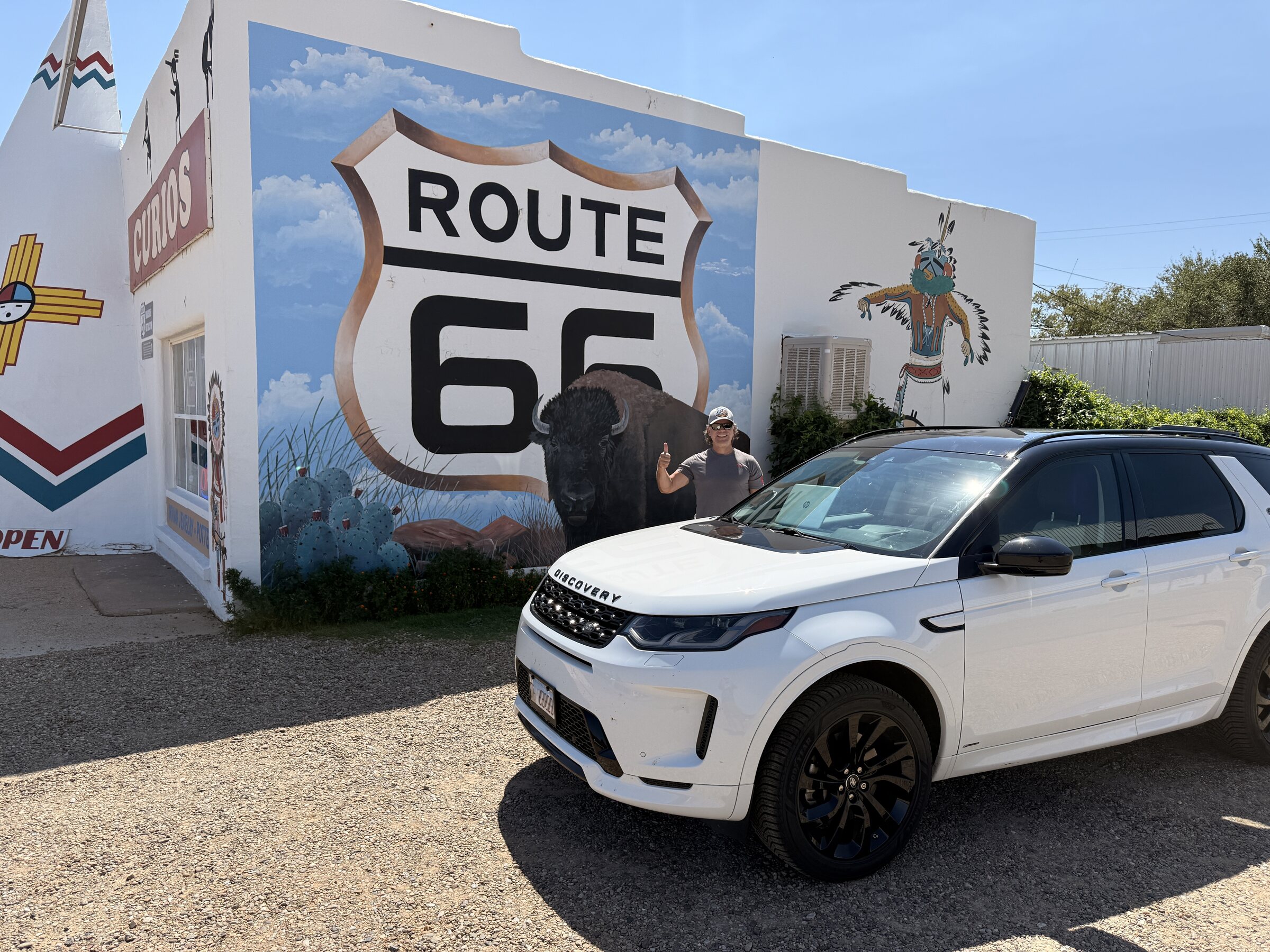 The expedition vehicle beside a Tucumcari Route 66 mural.