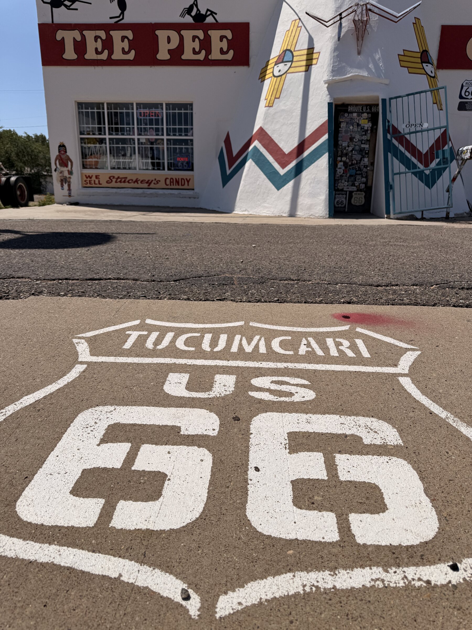 Tucumcari’s Route 66 pavement shield outside Tee Pee Curios.