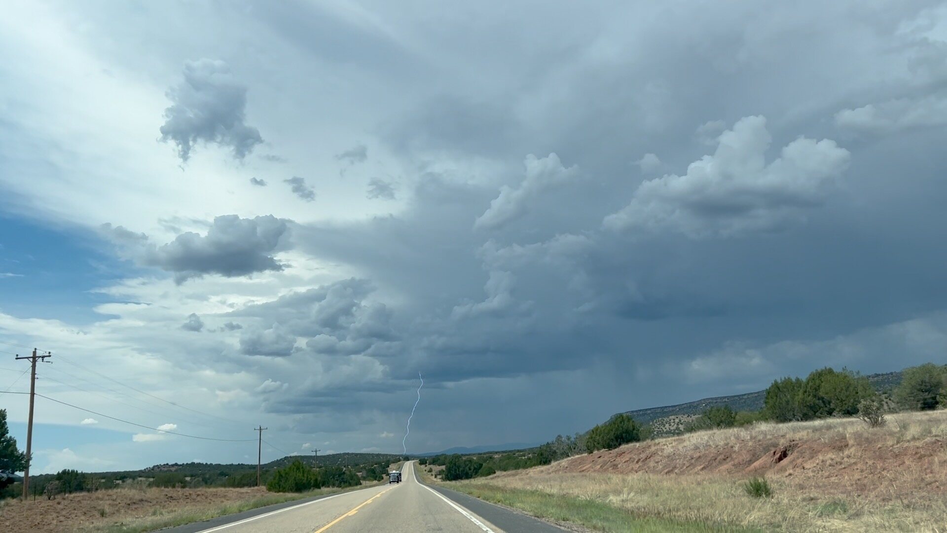 Lightning beneath the darkening New Mexico sky.