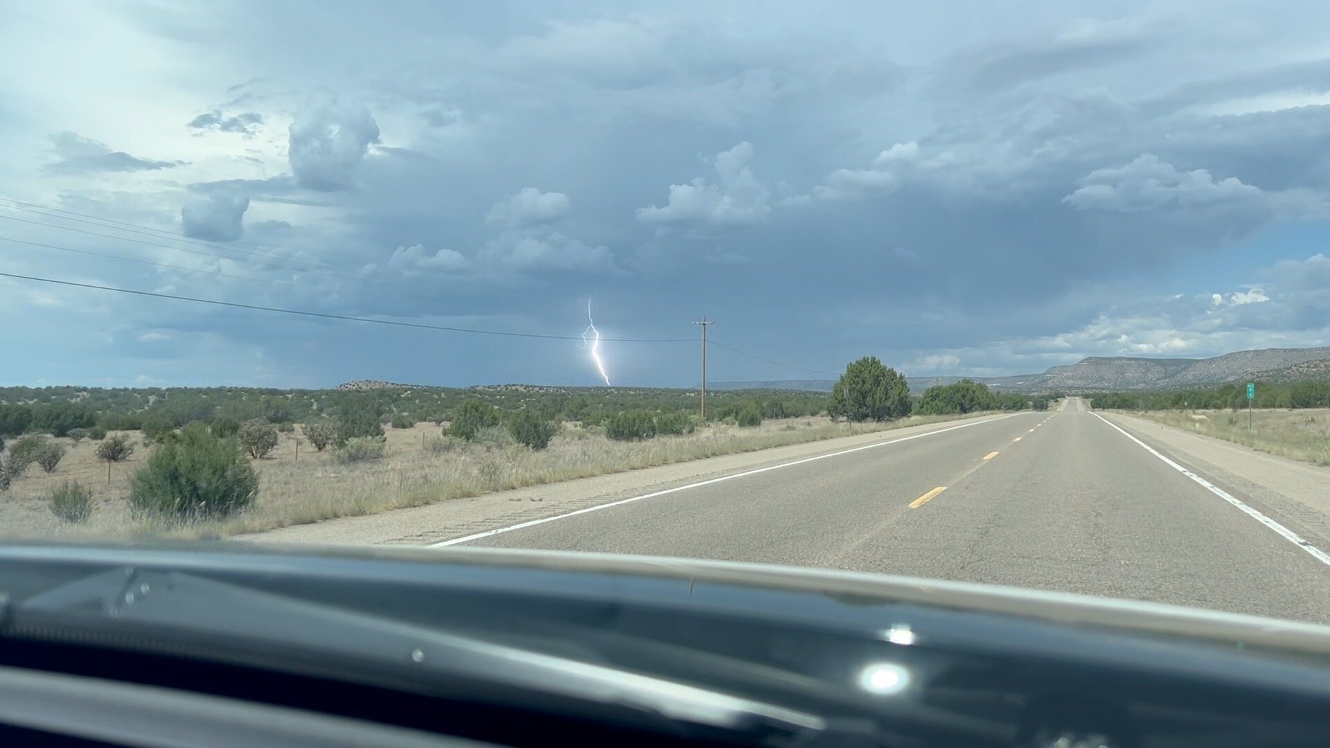 A lightning strike ahead as storms gathered near Santa Fe.