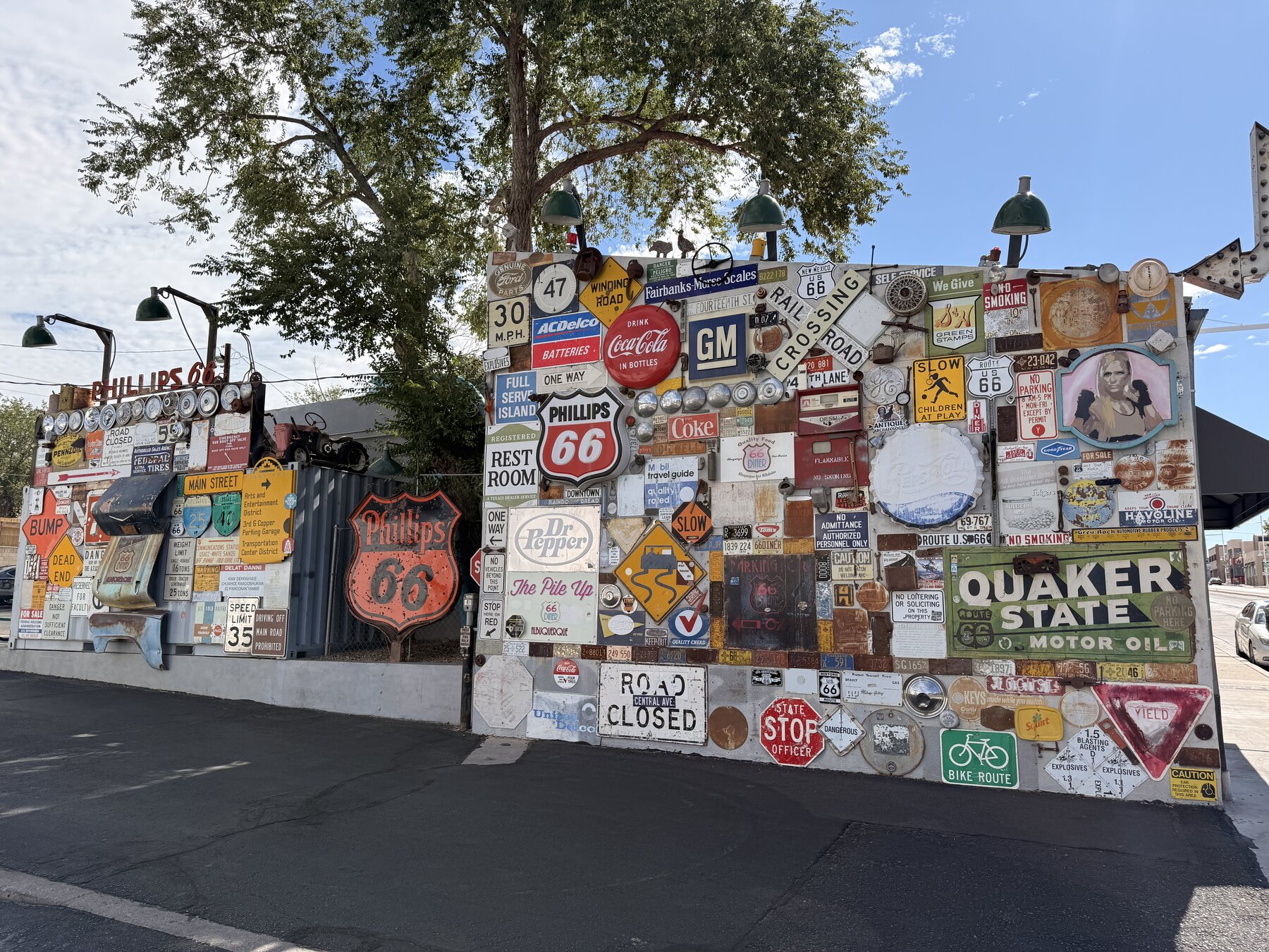 A colorful collection of vintage signs beside the 66 Diner.