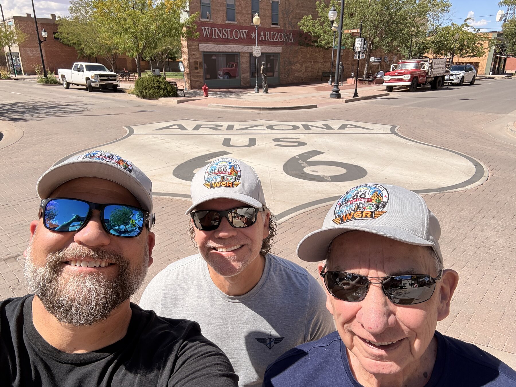 A crew selfie at the giant Route 66 shield in Winslow.