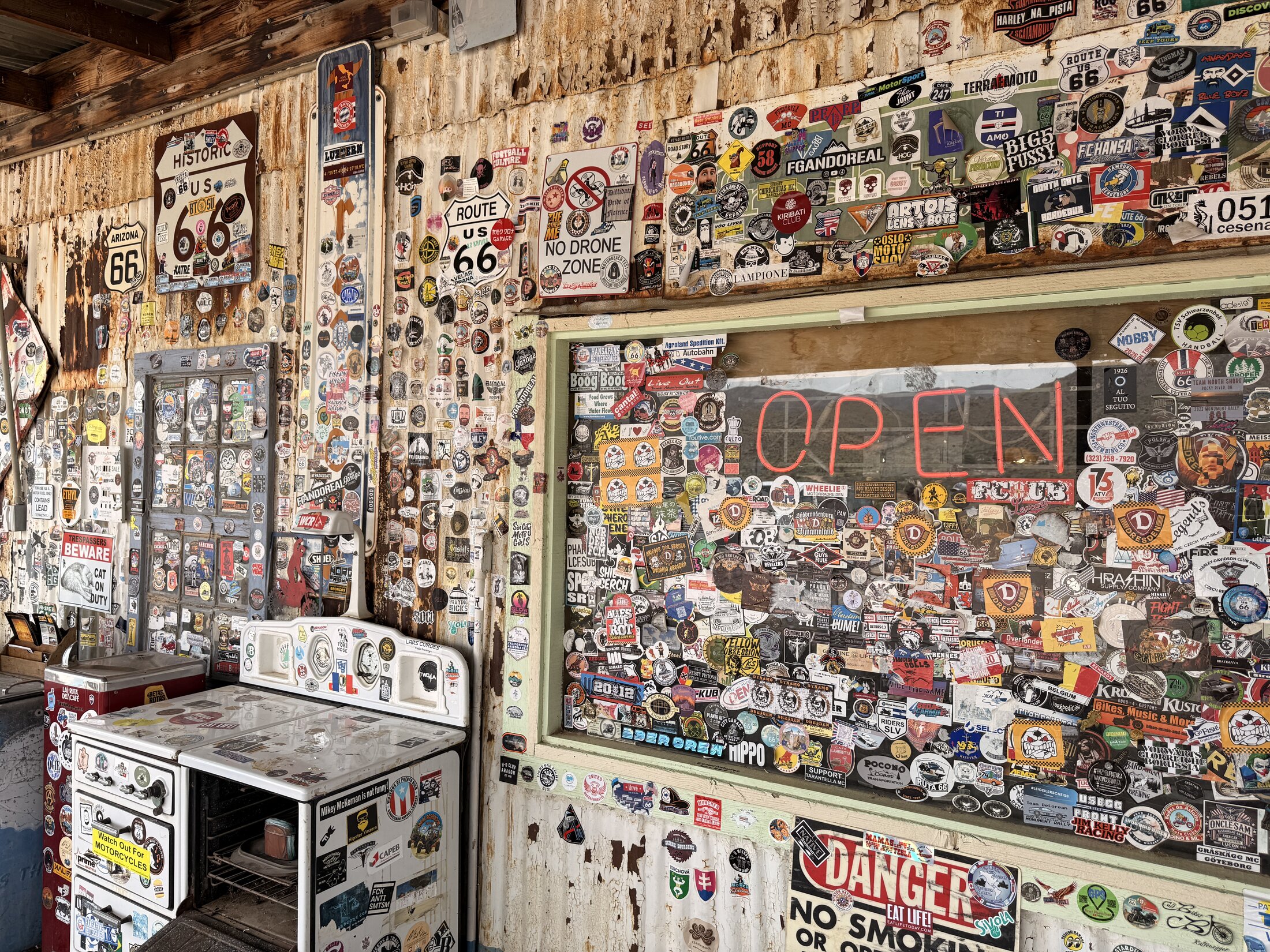 Visitors have covered nearly every surface inside Hackberry with stickers and signatures.