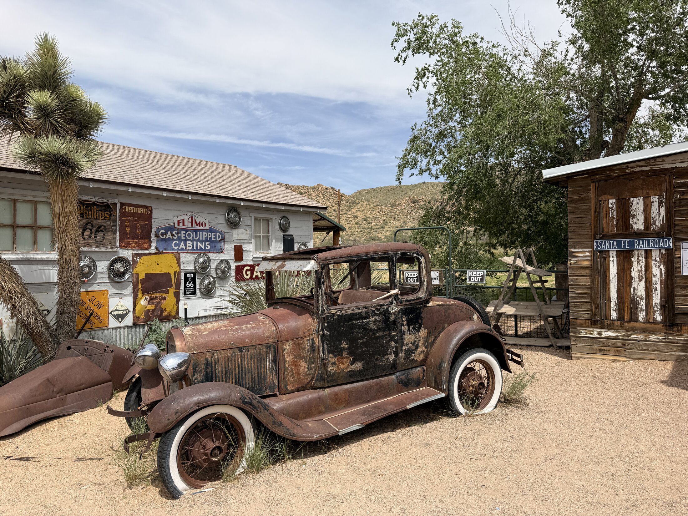 One of the rusted vintage automobiles preserved at Hackberry.