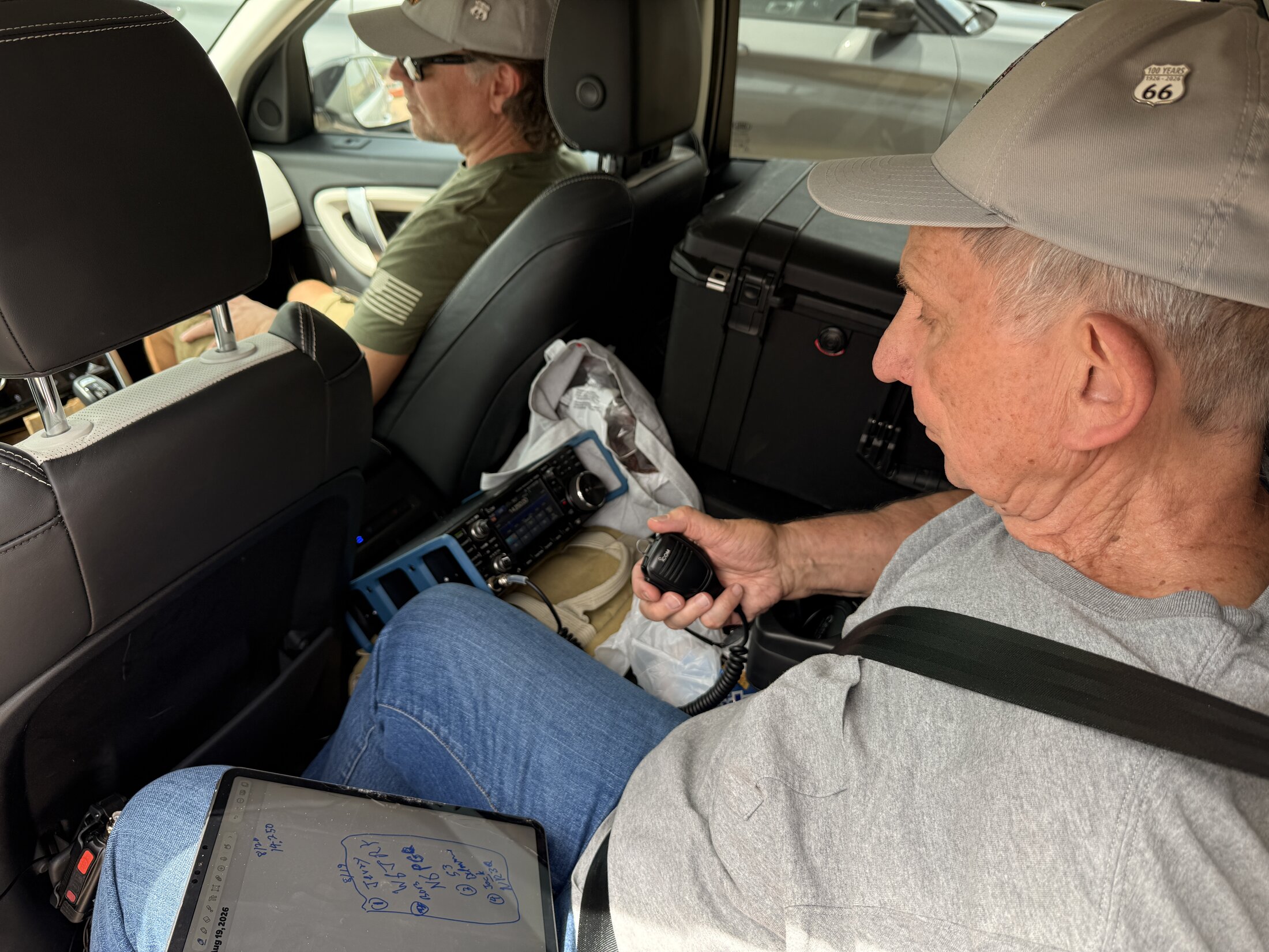 Steve tries the radio from the back seat during a roadside stop.