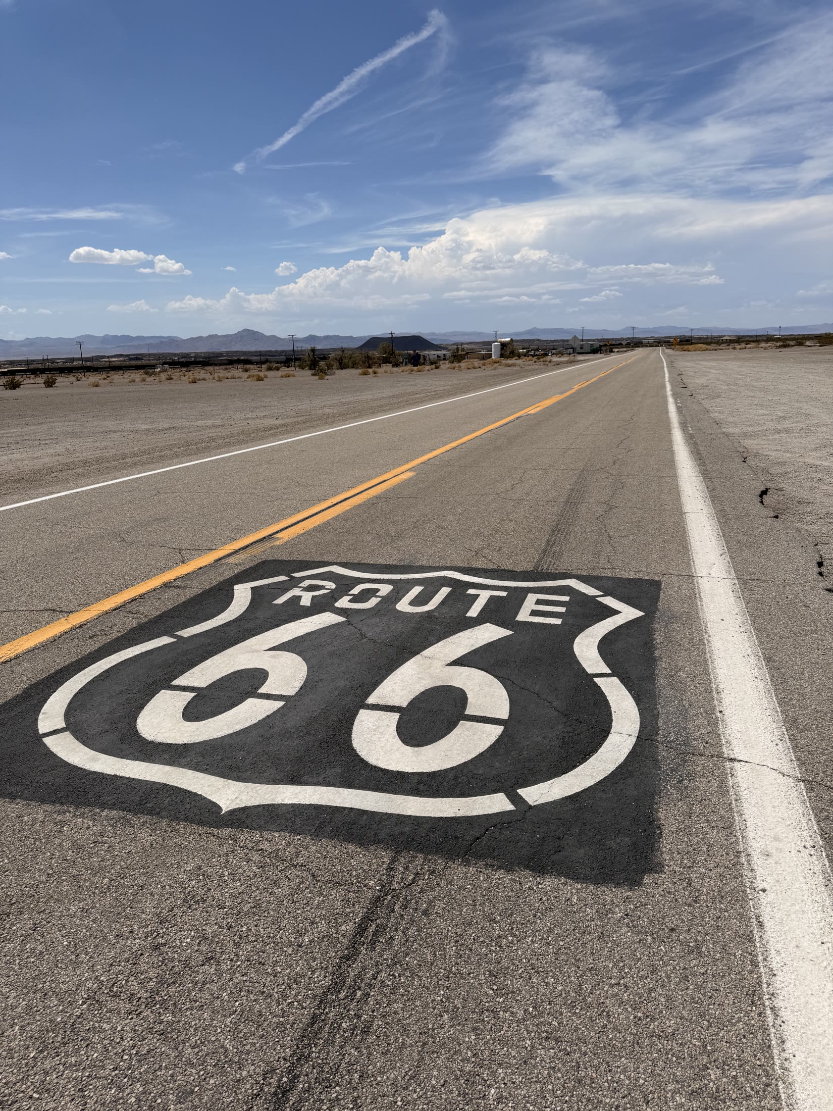 A Route 66 pavement shield welcomes us to California.