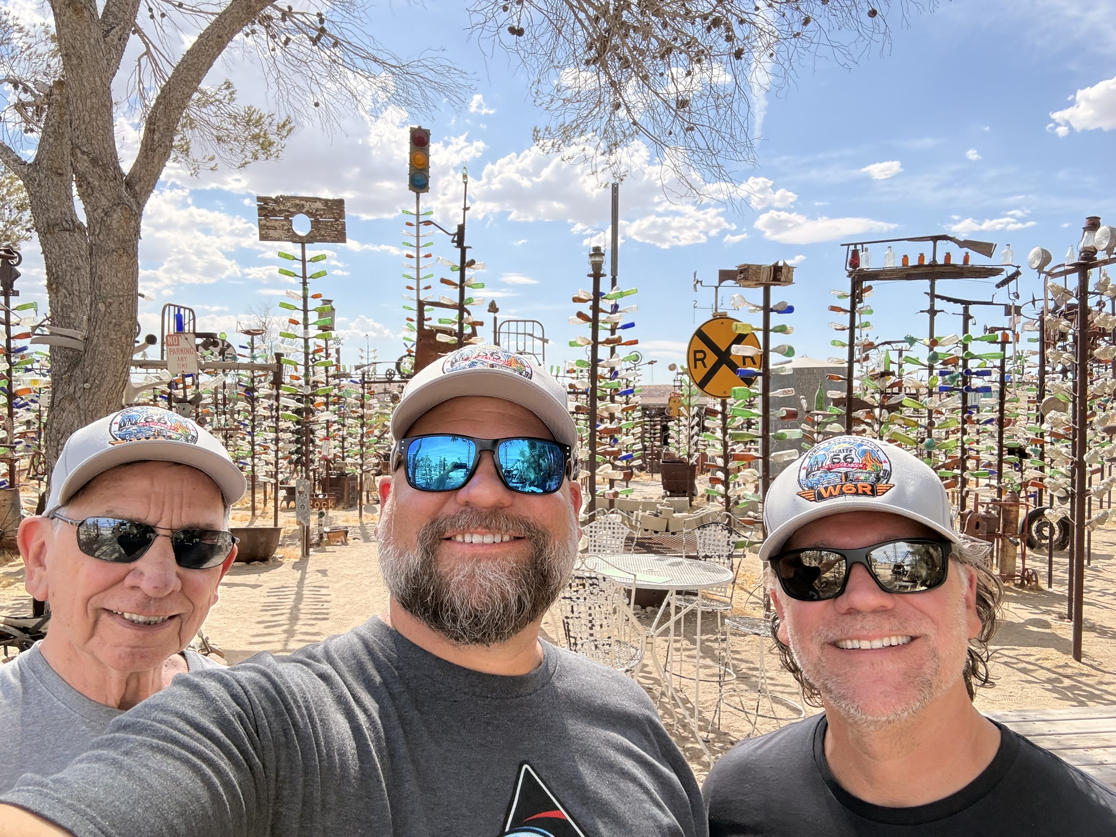 The W6R crew among the bottle trees and desert artwork.