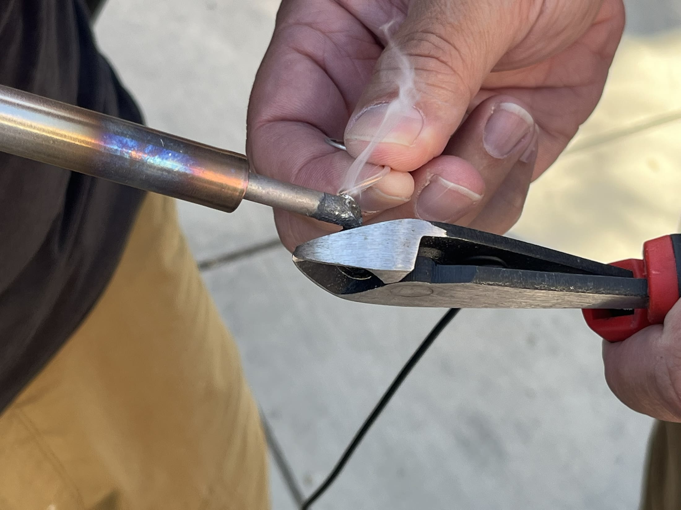 Resoldering the antenna connection in the hotel parking lot.