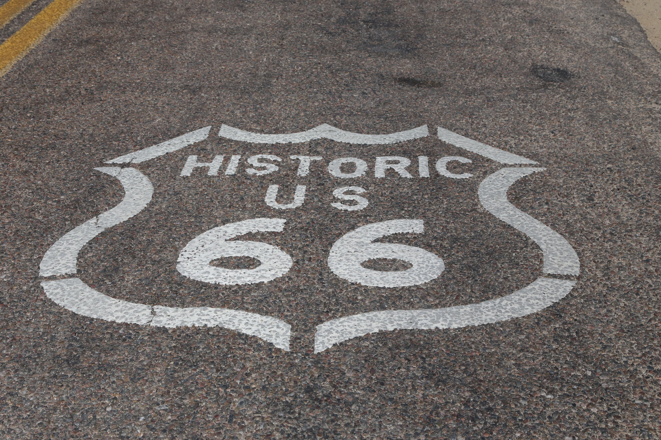 A Historic Route 66 shield painted on the Arizona pavement.