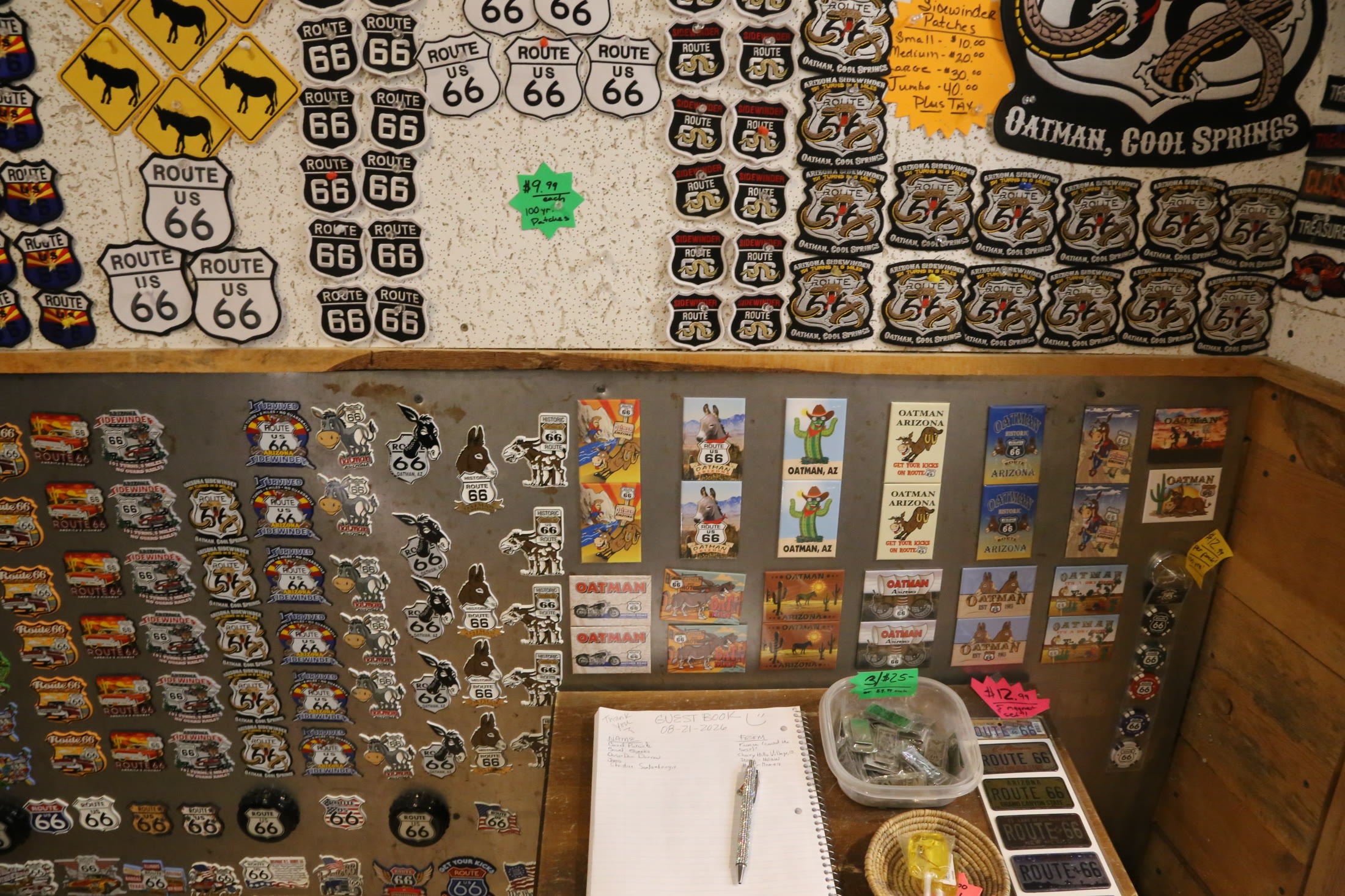 Route 66 badges and souvenirs inside the Cool Springs gift shop.