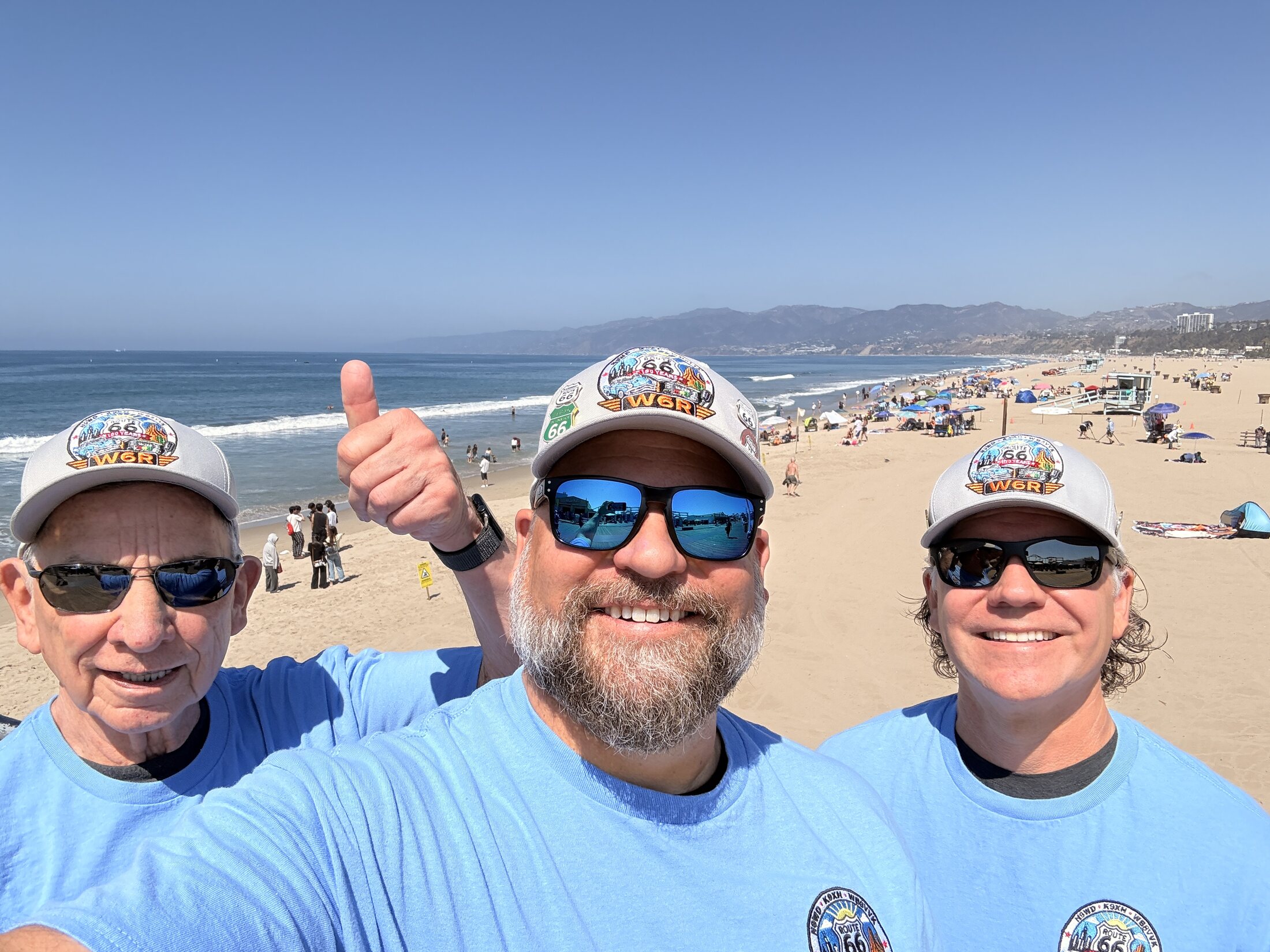 Celebrating the completed journey with Santa Monica Beach behind us.