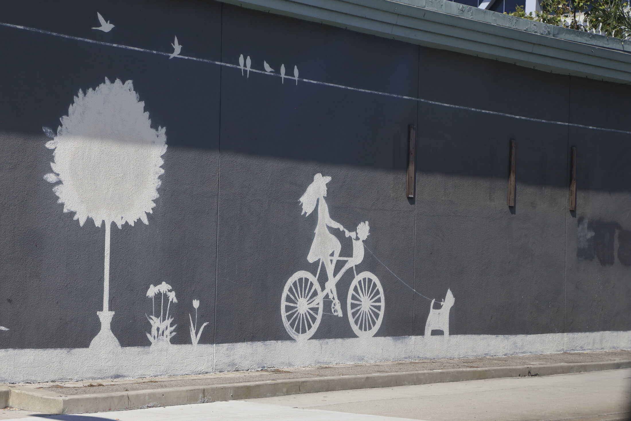 A bicyclist mural along the streets leading toward the Pacific.